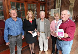 Masons Mel Sauer, Kevin Ward & Jim Scott present a Cadd Pump for delivery of medication donated by The Masonic Lodge to Little Haven Business manager Sue Manton and Registered Nurse Narelle Hosking. ,